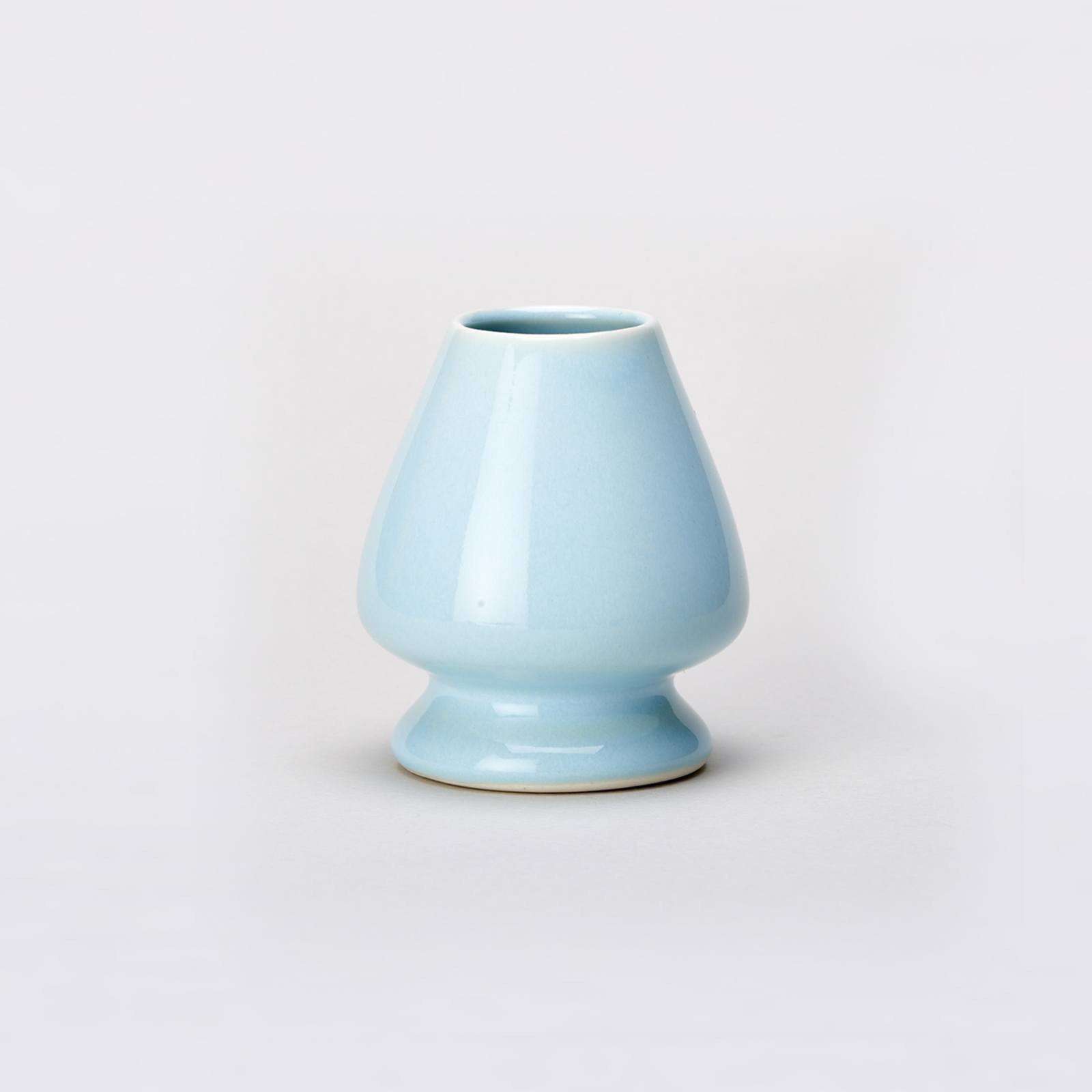 Blue Matcha Whisk stand on grey background