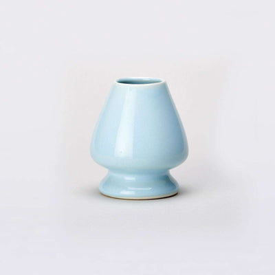 Blue Matcha Whisk stand on grey background